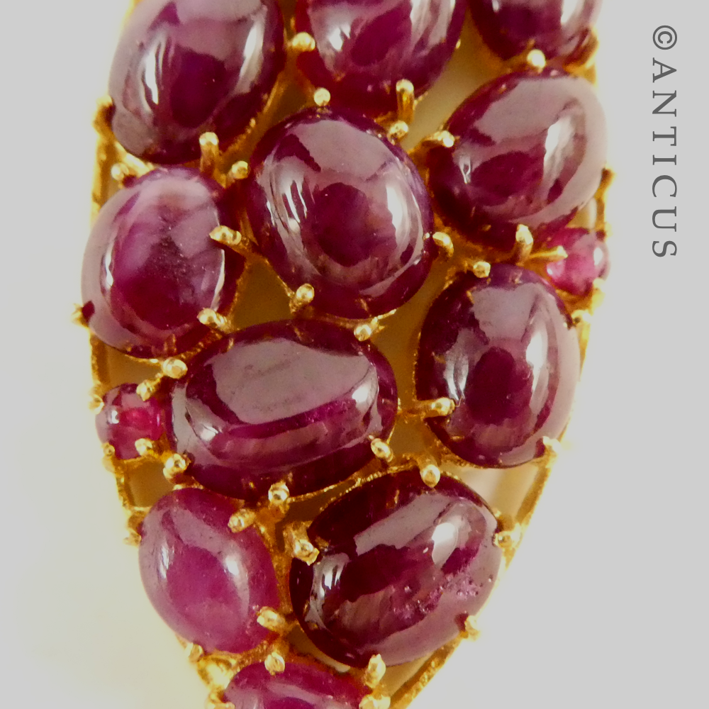 Antique-Style Pendant with Cabochon Rubies and Diamonds.