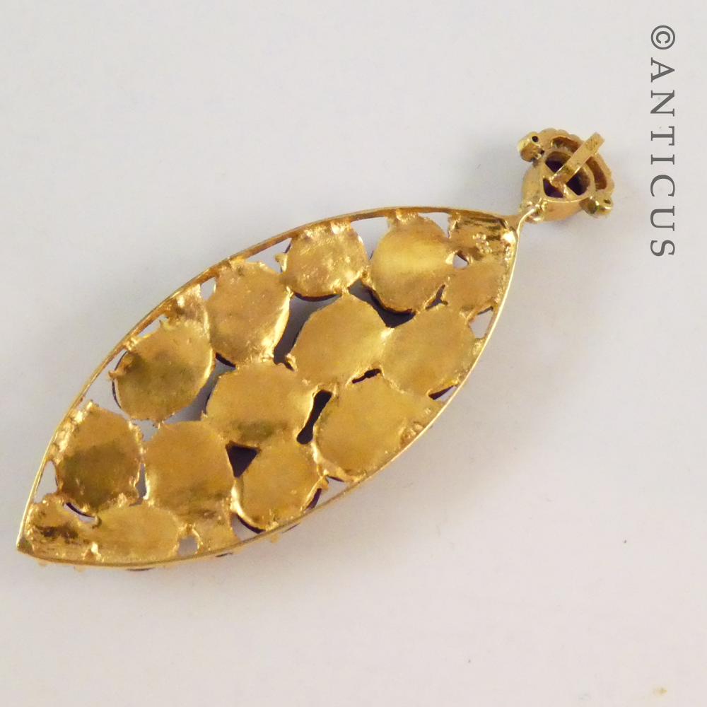 Antique-Style Pendant with Cabochon Rubies and Diamonds.