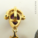 Antique-Style Pendant with Cabochon Rubies and Diamonds.