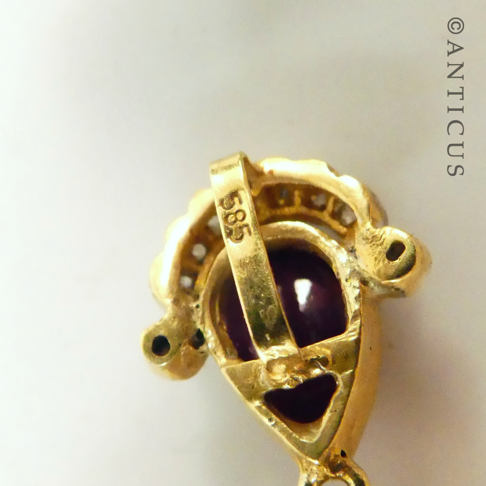 Antique-Style Pendant with Cabochon Rubies and Diamonds.