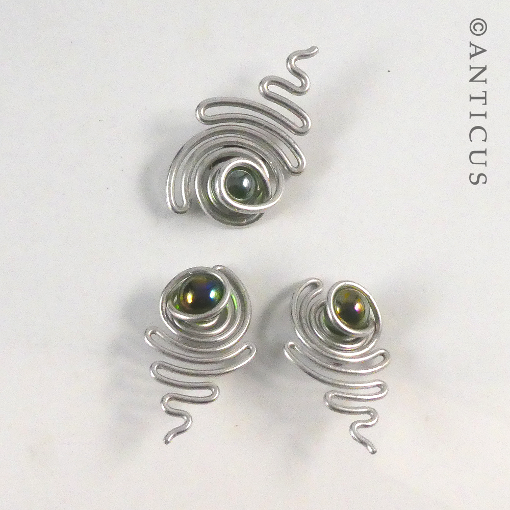 Craftsman-made Earrings and Brooch.