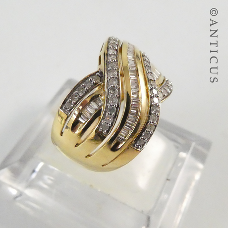 Gold and Diamond Wide Cross-Over Ring.