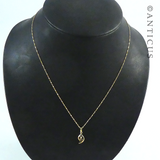 Small Garnet Pendant on Gold Chain.