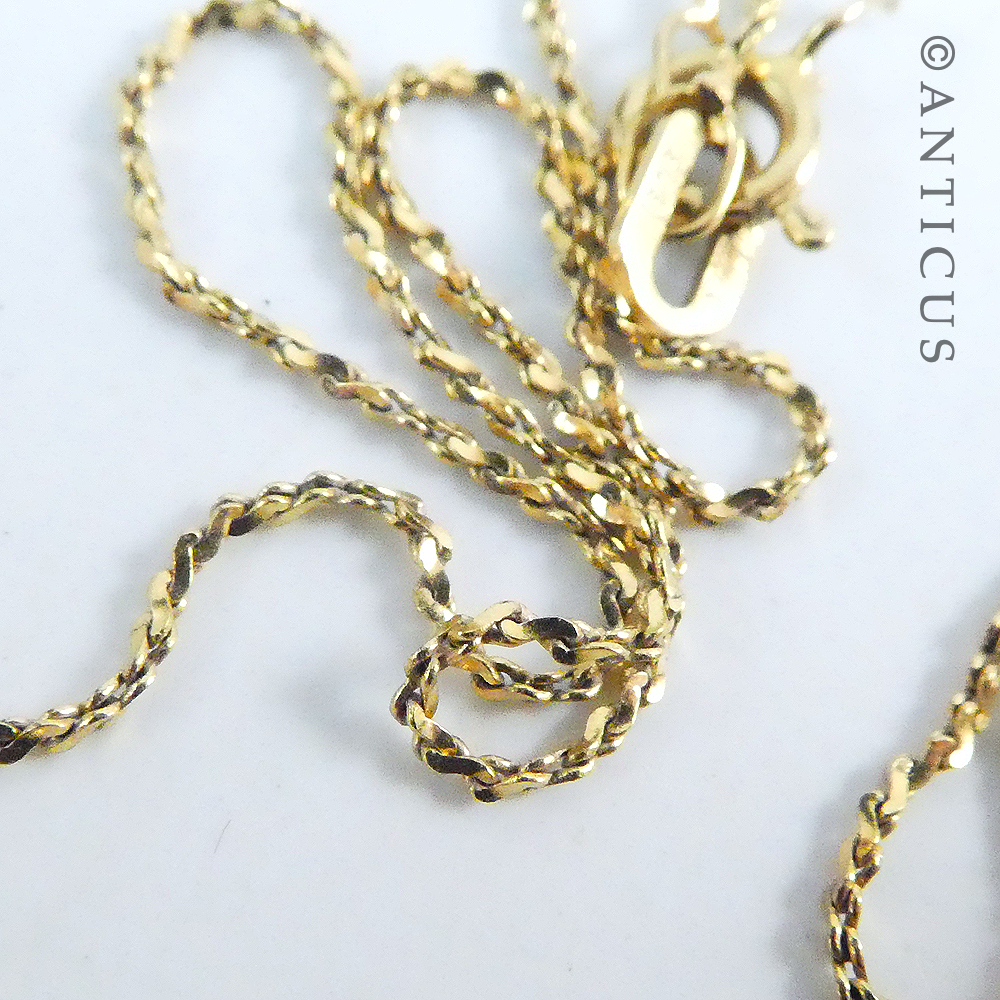 Small Garnet Pendant on Gold Chain.