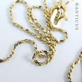 Small Garnet Pendant on Gold Chain.