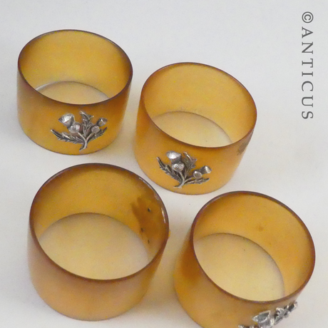 Set of 4 Horn and Silver Napkin Rings.