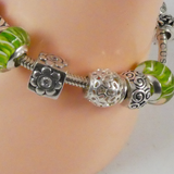 Silver Charm Bracelet with 12 Charms.