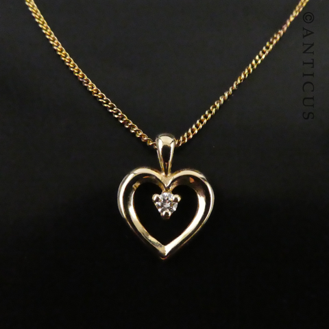 Gold Heart Pendant with a Diamond.