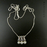 Three Pearl Pendants on Silver Chain.