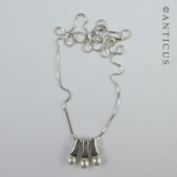 Three Pearl Pendants on Silver Chain.