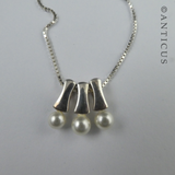 Three Pearl Pendants on Silver Chain.