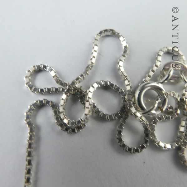 Three Pearl Pendants on Silver Chain.