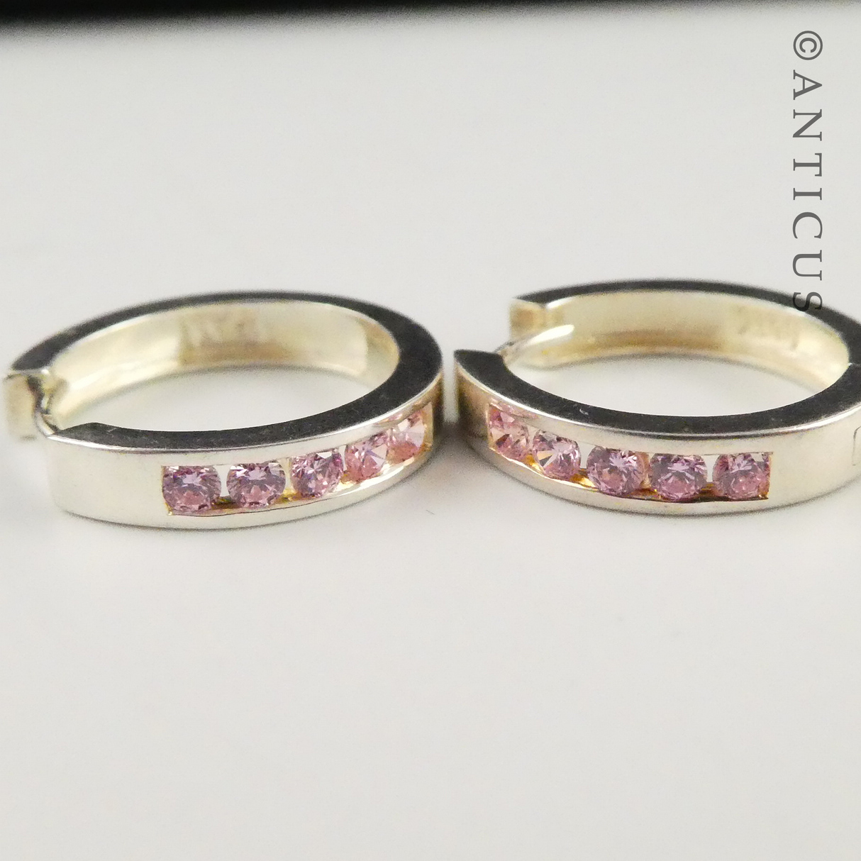 Silver Hoop Earrings with Inset Pink CZs.