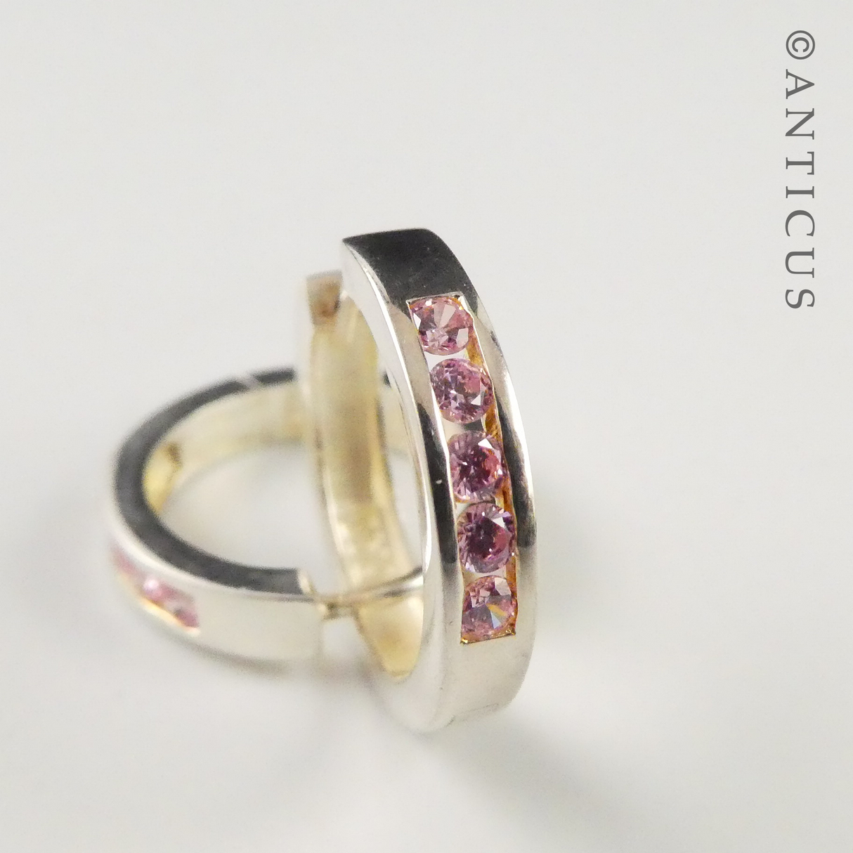 Silver Hoop Earrings with Inset Pink CZs.