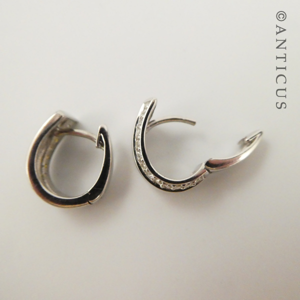 Pair of Silver Huggie Earrings with CZ's.
