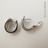 Pair of Silver Huggie Earrings with CZ's.
