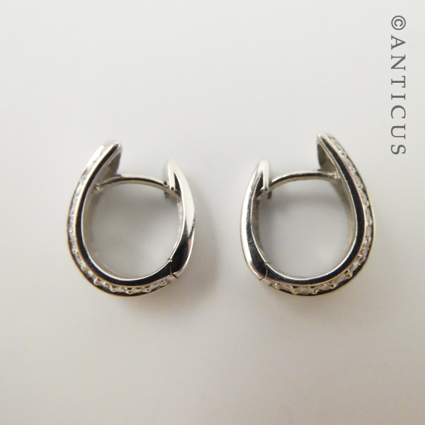 Pair of Silver Huggie Earrings with CZ's.