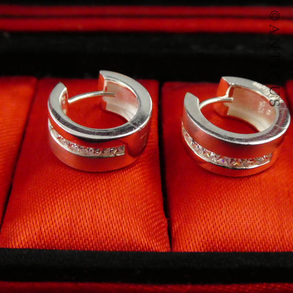 Pair of Silver Hoop Earrings, CZ Stones.