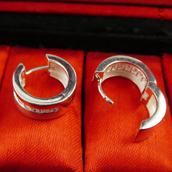 Pair of Silver Hoop Earrings, CZ Stones.