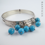 Silver Multi Bangles with Turquoise Beads.