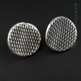 Concave Silver Disc Earrings with Hatched Design.