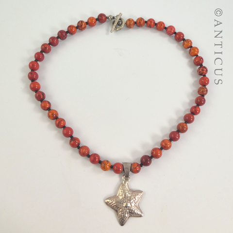 Coral Coloured Necklace with Silver Starfish Pendant.