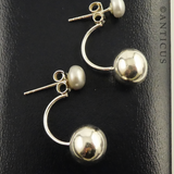 Silver and White Pearl Ear Hugging Earrings.