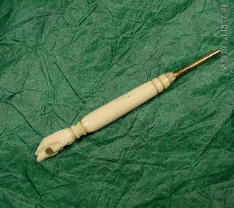 Carved Bone Fist Handle, containing Stanhope.