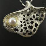 Pearl and Silver Pendant on Chain.