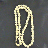 Long Strand, Carved Bone Beads, Early 20th Century.