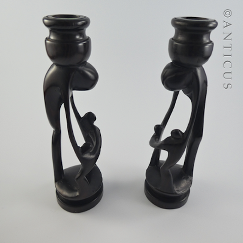 Pair of African Ebony Figurative Candlesticks.