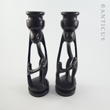 Pair of African Ebony Figurative Candlesticks.