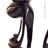 Pair of African Ebony Figurative Candlesticks.