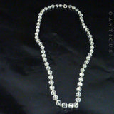 Graduated Strand Crystal Beads on Chain.
