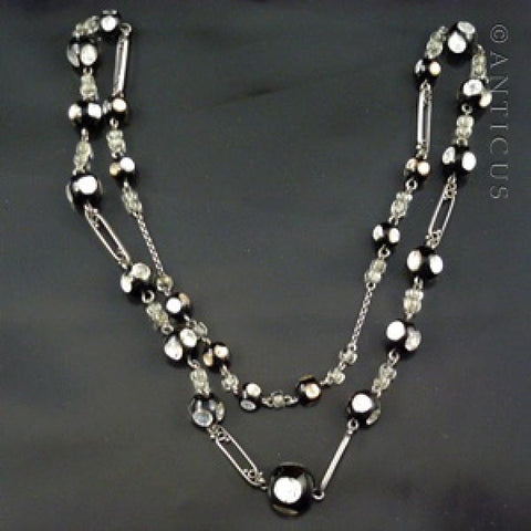 Black Venetian Glass and Silver Foiled Beads on Chain.