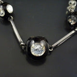 Black Venetian Glass and Silver Foiled Beads on Chain.