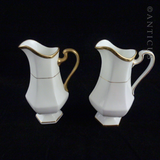 Pair of Minton Gold and White Jugs.