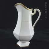 Pair of Minton Gold and White Jugs.