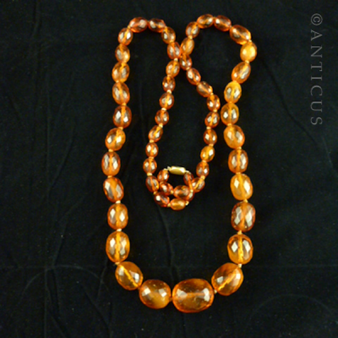 Long Strand of Faceted Baltic Amber Beads.