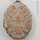 Sterling Silver Locket with Gold Decoration.