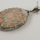 Sterling Silver Locket with Gold Decoration.