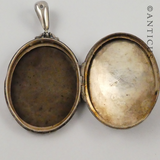 Sterling Silver Locket with Gold Decoration.