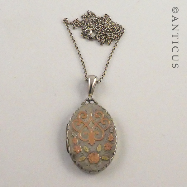 Sterling Silver Locket with Gold Decoration.