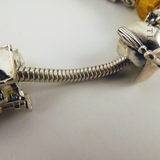 Modern Charm Bracelet, Silver, 17 Charms.