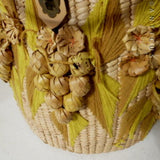 Large Round Raffia Lidded Basket with Nuts & Leaves Decoration.