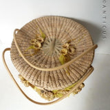 Large Round Raffia Lidded Basket with Nuts & Leaves Decoration.
